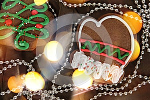 Banner for Christmas and New Year gingerbread. Christmas trees, toys, snowmen, garlands on a background of brown silk