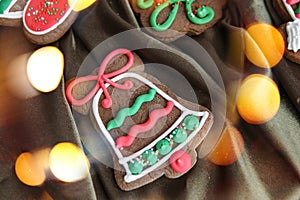 Banner for Christmas and New Year gingerbread. Christmas trees, toys, snowmen, garlands on a background of brown silk