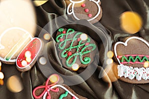 Banner for Christmas and New Year gingerbread. Christmas trees, toys, snowmen, garlands on a background of brown silk