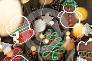 Banner for Christmas and New Year gingerbread. Christmas trees, toys, snowmen, garlands on a background of brown silk