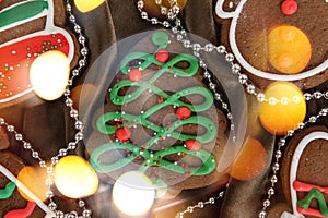 Banner for Christmas and New Year gingerbread. Christmas trees, toys, snowmen, garlands on a background of brown silk