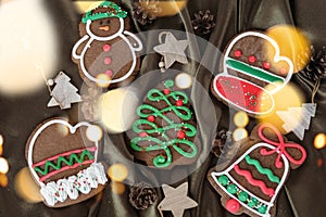 Banner for Christmas and New Year gingerbread. Christmas trees, toys, snowmen, garlands on a background of brown silk