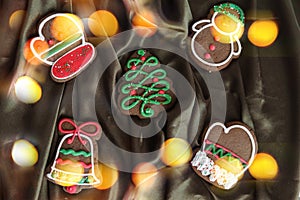 Banner for Christmas and New Year gingerbread. Christmas trees, toys, snowmen, garlands on a background of brown silk