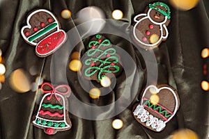 Banner for Christmas and New Year gingerbread. Christmas trees, toys, snowmen, garlands on a background of brown silk