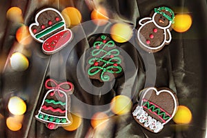 Banner for Christmas and New Year gingerbread. Christmas trees, toys, snowmen, garlands on a background of brown silk