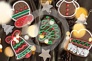 Banner for Christmas and New Year gingerbread. Christmas trees, toys, snowmen, garlands on a background of brown silk