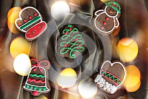 Banner for Christmas and New Year gingerbread. Christmas trees, toys, snowmen, garlands on a background of brown silk