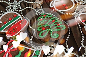 Banner for Christmas and New Year gingerbread. Christmas trees, toys, snowmen, garlands on a background of brown silk