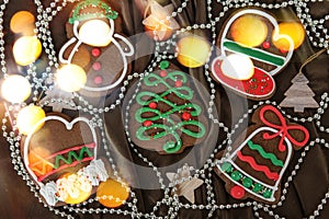 Banner for Christmas and New Year gingerbread. Christmas trees, toys, snowmen, garlands on a background of brown silk