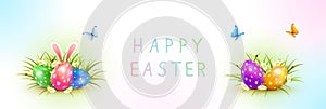 Banner with Colored Easter Eggs and Rabbit in Grass