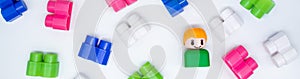 Banner colorful building blocks, toys plastic figure on white background