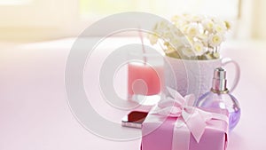 Banner Composition flat lay gift to a woman Modern gadget mobile phone glass cocktail perfume bouquet of flowers Preparing for the