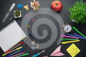 Banner concept Back to School Alarm clock, pencil Apple Notebook Stationery on blackboard background. Design Copy Space accessorie