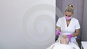 Banner Cosmetologist Making Mesotherapy Injection With Dermapen On Face Of Beautiful Young photo