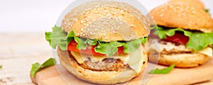 Banner of Craft beef burger on wooden table on light background