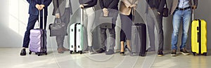 Banner with cropped shot of business people with luggage waiting in line at the airport