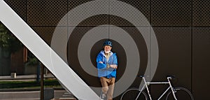 Banner with elderly man, cyclist traveling through the city by bike. Vital senior city commuter riding a bike