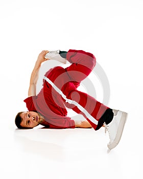 Banner. Fashionable portrait. Stylishly dressed young sportive man performing dance, freestyle, breakdance elements in