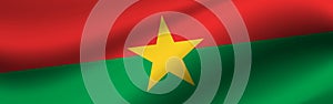 Banner with the flag of Burkina Faso. Fabric texture of the flag of Burkina Faso