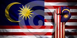 Banner of Flag of Malaysia painted on male fist, fist flag, country of Malaysia, strength, power, concept of conflict. On a