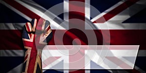 Banner of Flag of United Kingdom painted on male fist, fist flag, country of UK, strength, power, concept of conflict. On a