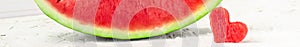 banner of Fresh juicy watermelon slice with heart shape hole on white background. Valentines, love, summer concept