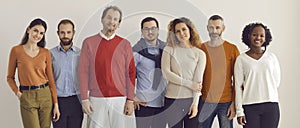 Banner with group of confident diverse people in comfortable casual wear standing in studio