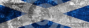 Banner of grunge Scottish flag. Dirty Scotland flag on a metal surface