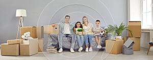 Banner with happy family sitting on sofa in new house or apartment on moving day