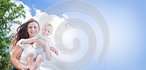 Banner of healthy child (kid) with mother in the sunny summer day. Caucasians happy baby (boy).