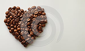 banner with A heart shape formed with coffee beans on a white background, symbolizing love for coffee and its energizing photo