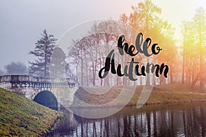 Banner hello autumn. New month. Greeting card. Golden autumn. Autumn in the park. The text in the photo. Trees in the autumn park