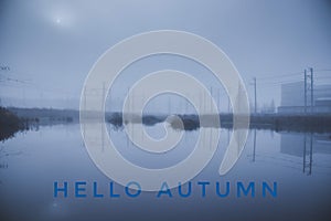 Banner hello autumn. New month. Greeting card. Golden autumn. The text in the photo. Seasons . Heavy fog. Trees in the fog