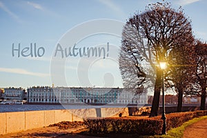 Banner hello autumn. New month. Greeting card. Golden autumn. The text in the photo. Seasons . Leaves. Tree. City street