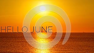 Banner hello june. Text on the photo. Text hello June. New month. New season. Summer month. Text on sunset photo