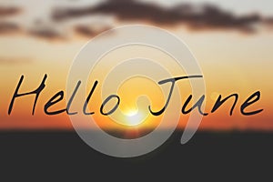 Banner hello june. Text on the photo. Text hello June. New month. New season. Summer month. Text on sunset photo