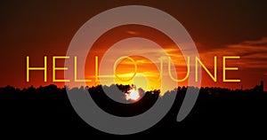 Banner hello june. Text on the photo. Text hello June. New month. New season. Summer month. Text on sunset photo