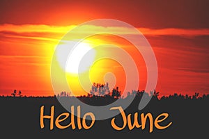 Banner hello june. Text on the photo. Text hello June. New month. New season. Summer month. Text on sunset photo