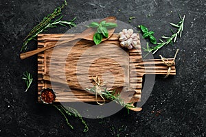 Banner of homemade cooking recipes. Kitchen old wooden board, spices and herbs, free space for text.