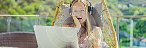 BANNER, LONG FORMAT Caucasian woman sitting on the terrace working from home using computer laptop. Young woman teaches