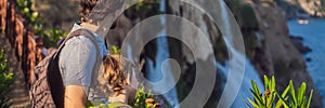 BANNER, LONG FORMAT Father and son tourists on the background of Duden waterfall in Antalya. Famous places of Turkey