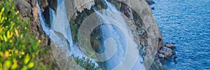 BANNER, LONG FORMAT Lower Duden Falls drop off a rocky cliff falling from about 40 m into the Mediterranean Sea in