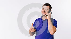 Banner,long format. A man is talking on a cell phone and showing thumb up to the camera. White background with empty