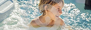 BANNER, LONG FORMAT Portrait of young carefree happy smiling boy relaxing at hot tub during enjoying happy traveling