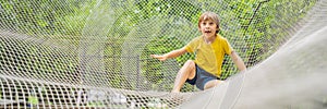 BANNER, LONG FORMAT practice nets playground. boy plays in the playground shielded with a protective safety net. concept