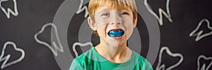 BANNER, LONG FORMAT Six-year old boy shows myofunctional trainer. Helps equalize the growing teeth and correct bite