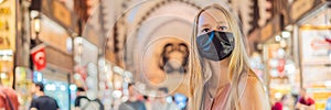 BANNER, LONG FORMAT A tourist woman walks among the countless shops at the Grand Bazaar and Egyptian Bazaar in Istanbul