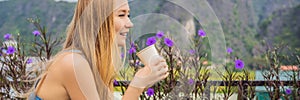 BANNER, LONG FORMAT Woman drinks coffee in the morning on the background of hills in Ninh Binh, Tam Coc. Resumption of