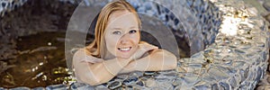 BANNER, LONG FORMAT Woman relaxing in round outdoor fragrant herbal bath, organic skin care, luxury spa hotel, lifestyle