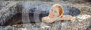 BANNER, LONG FORMAT Woman relaxing in round outdoor fragrant herbal bath, organic skin care, luxury spa hotel, lifestyle
